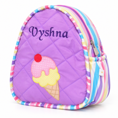 Purple quilted backpack with an ice cream cone patch and pastel striped edges, featuring the name 'Vyshna' on the front panel.
