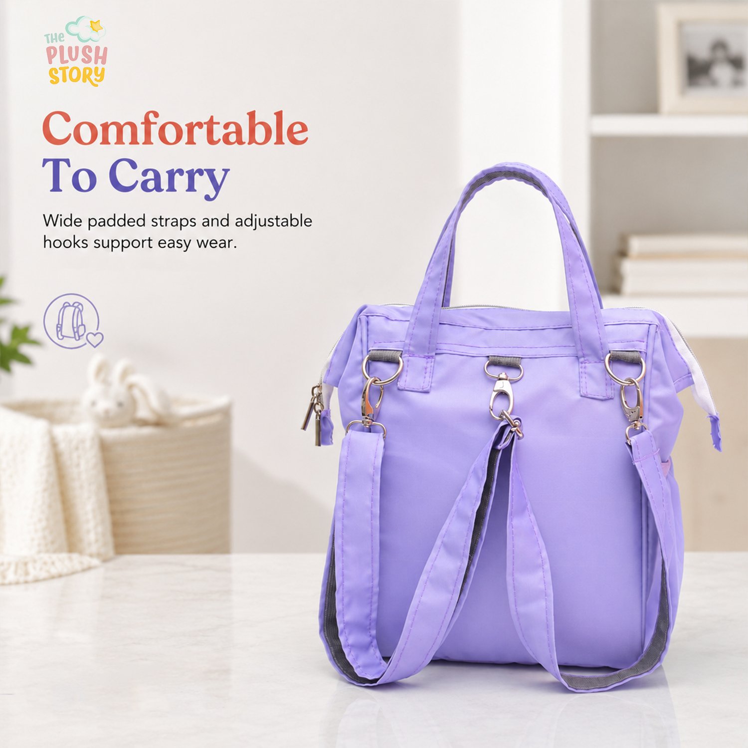 Purple tote bag with wide padded straps and metal hardware, shown in a bright retail setting. The image advertises easy wear and comfort to carry.