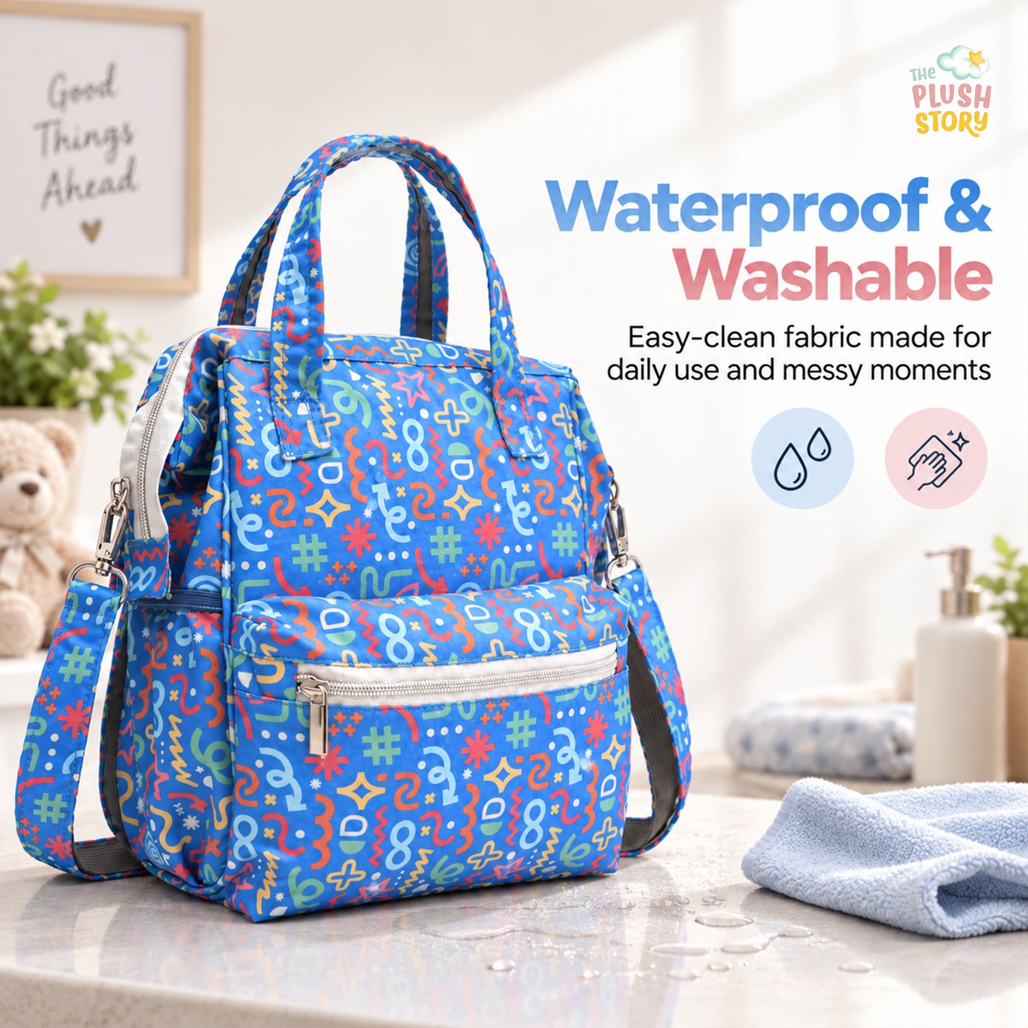 Bright blue backpack with a playful geometric print sits on a marble counter, with a 'Waterproof & Washable' sign in the background.