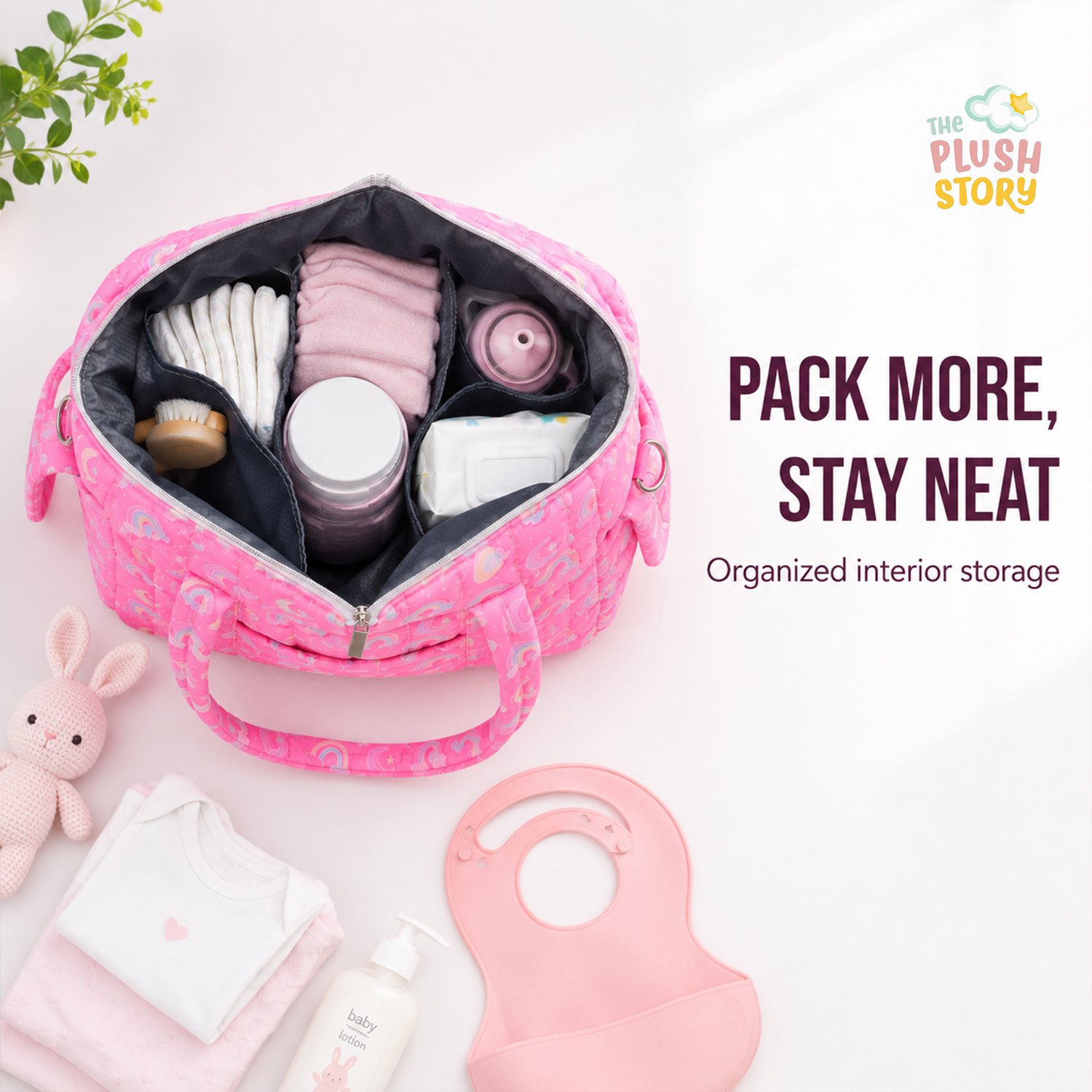 Open pink diaper bag with organized internal compartments and baby items like bottles and wipes visible, plus 'Pack More, Stay Neat' slogan on right.
