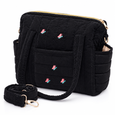 Black quilted shoulder bag with small pink flamingo embroidery and gold zipper, detachable strap included.