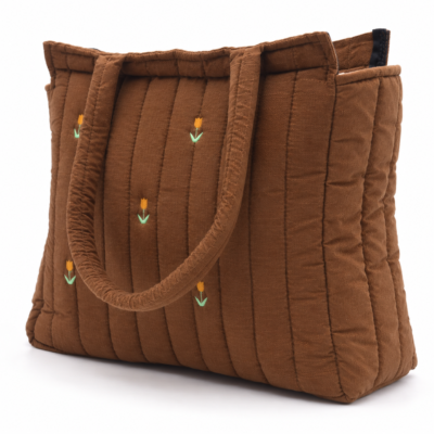 Brown quilted tote bag with small orange tulip embroidery along the sides and handles visible