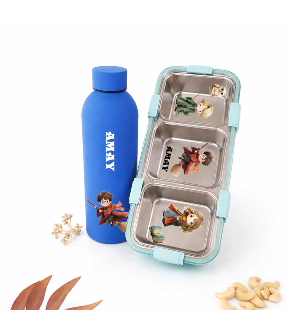 Blue water bottle with character decals beside a three-compartment lunchbox with teal latches and illustrated figures on each tray surface.