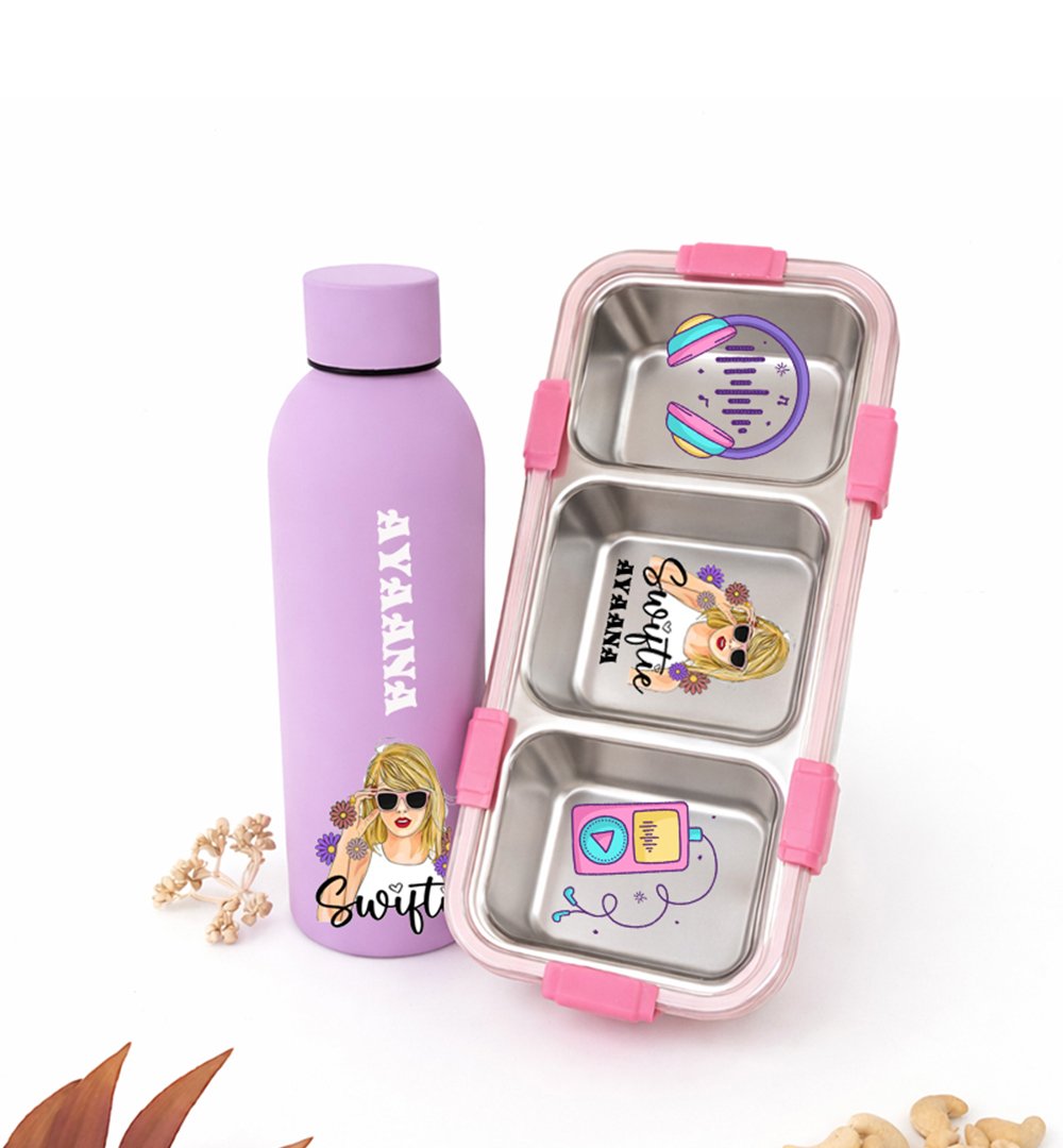 Purple kids' water bottle with cartoon stickers placed beside a pink stainless lunch box with three compartments and colorful decals on a white background