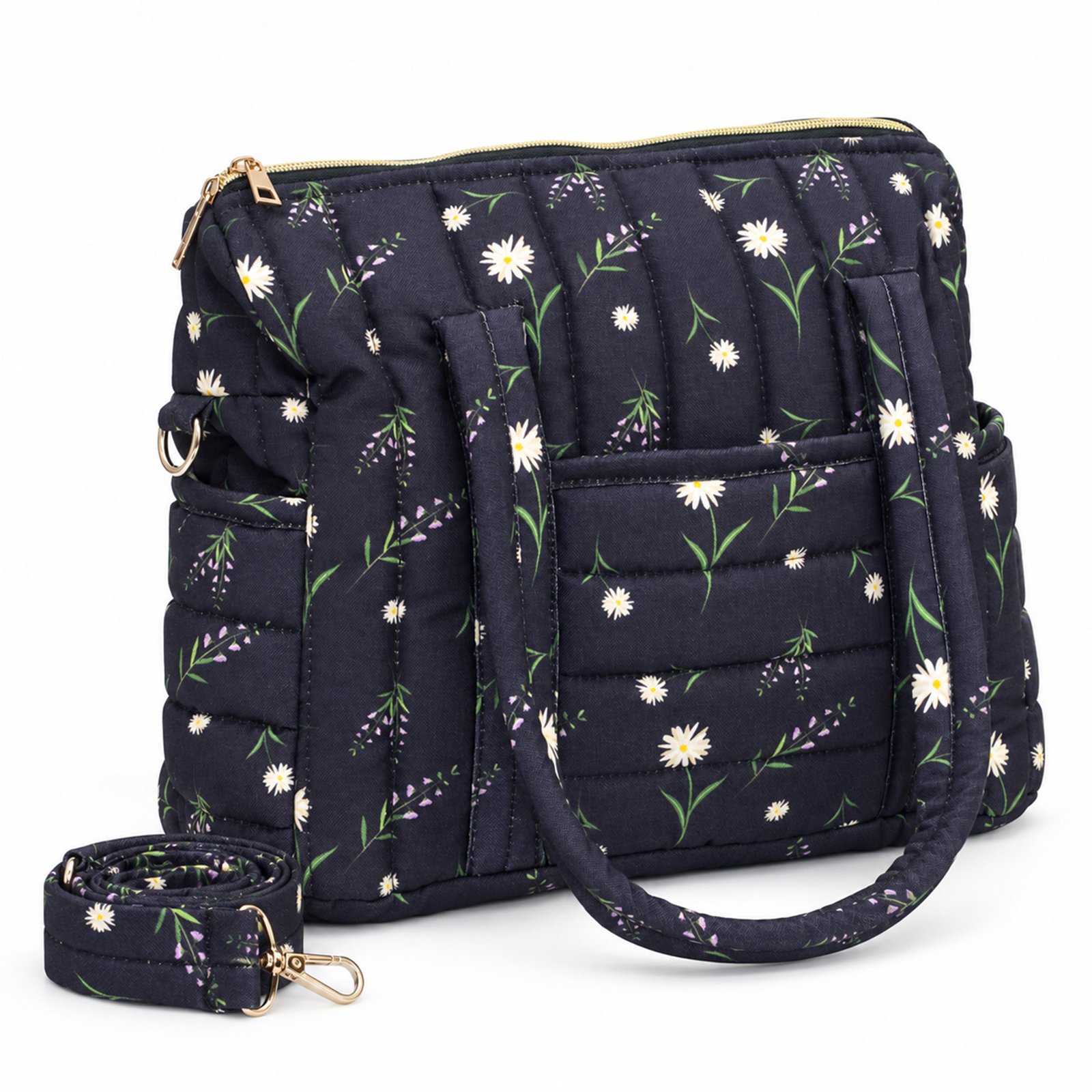 Navy quilted handbag with a floral pattern, gold zipper, and tied strap visible in the foreground.