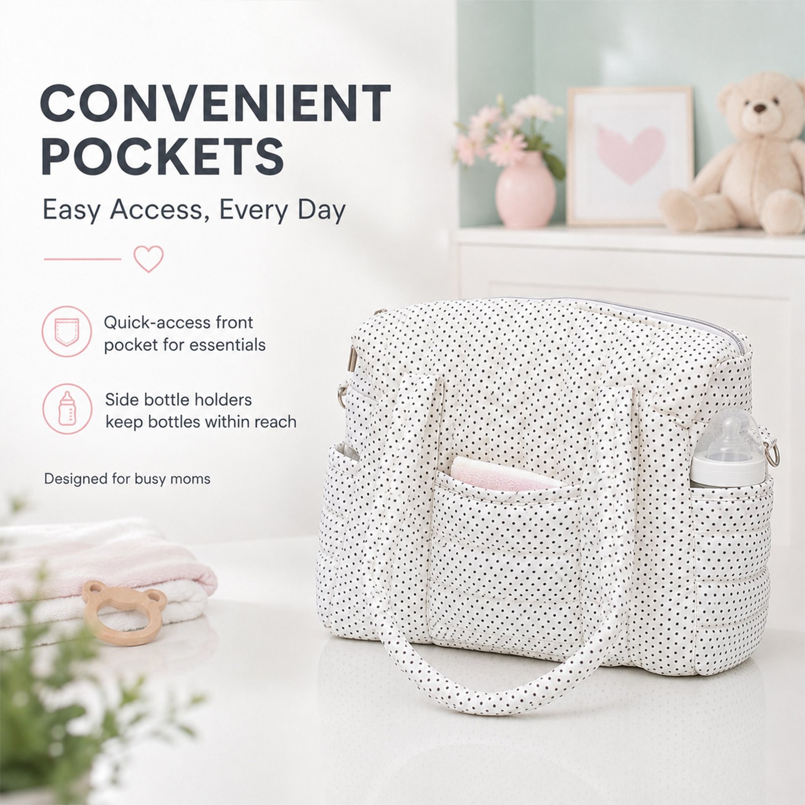 Diaper bag with black polka dots on a white surface in a light nursery setting, showcasing pocket features and accessories nearby.