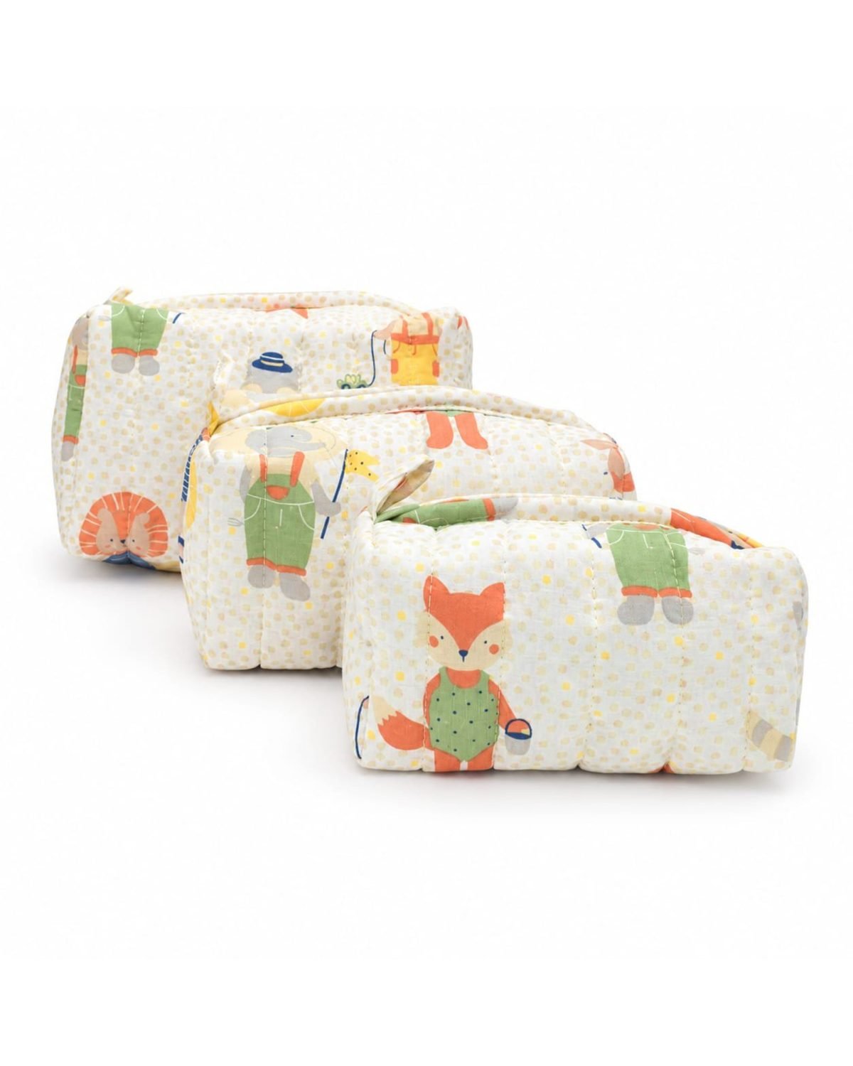 Stack of soft children's quilts with woodland animal prints on a pale polka-dotted background.