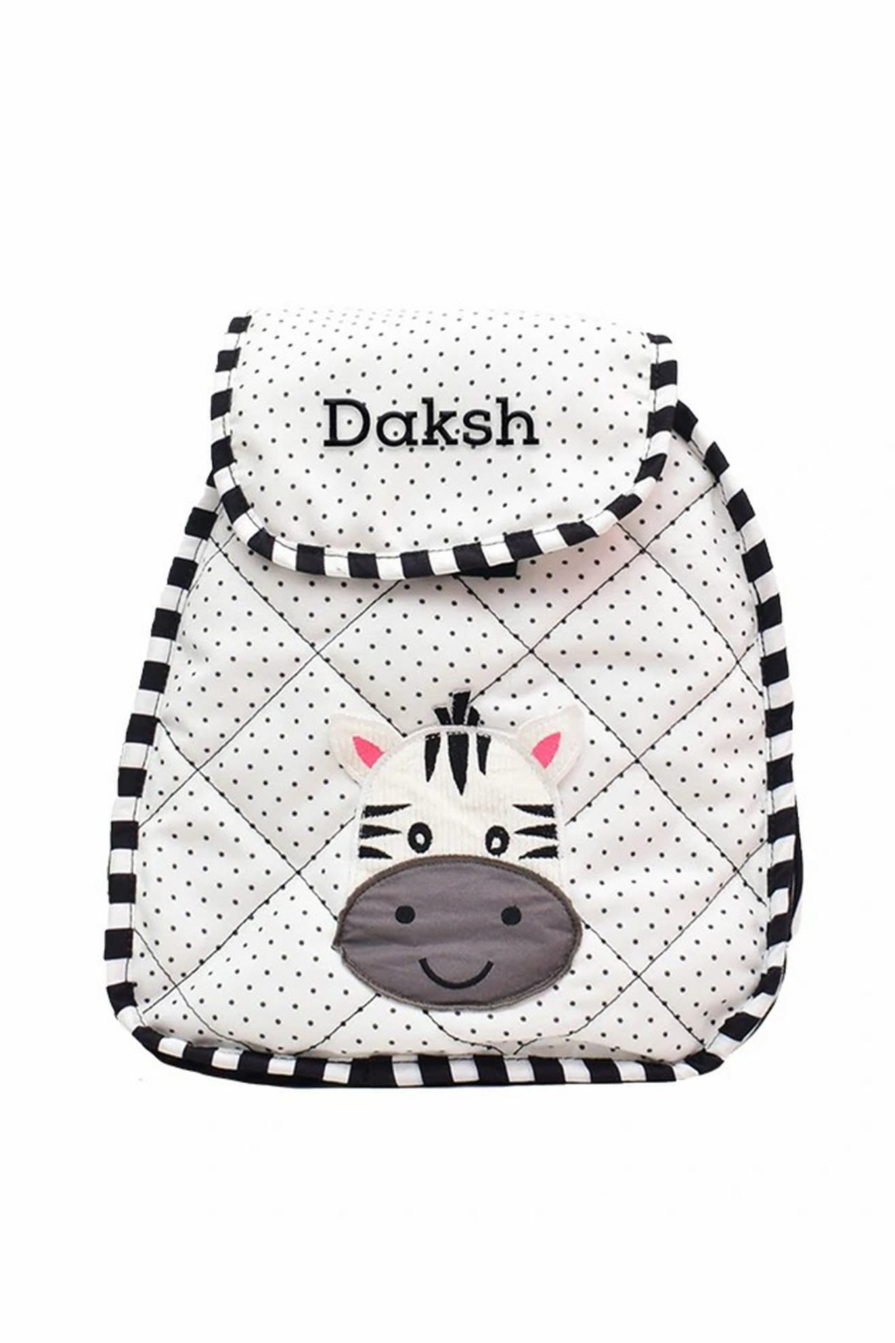 White polka-dotted children’s backpack with black trim and a zebra face on the front pocket; brand name 'Daksh' on the flap.